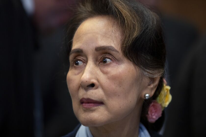 FILE - Myanmar's leader Aung San Suu Kyi waits to address judges of the International Court of Justice in The Hague, Netherlands, Dec. 11, 2019. A court in military-ruled Myanmar convicted former leader Aung San Suu Kyi in another criminal case Thursday, Sept. 29, 2022, and sentenced Australian economist Sean Turnell to three years in prison for violating an official secrets law, a legal official said. (AP Photo/Peter Dejong, File)