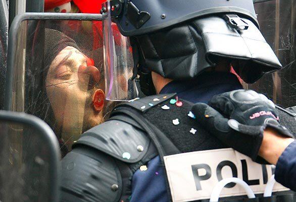 An anti- NATO activist dressed as a clown kisses the shield of a riot police officer in the Neuhoff district of Strasbourg, in eastern France, where NATO's 60th anniversary summit began Friday. Police arrested 300 people overnight, cleared the city centre of protesters and peace flags, and cut off public transport to a campsite housing thousands of demonstrators. • Photos: Obama in Europe • Photos: G20 protests • Complete coverage: Obama at the G20 and NATO Summits