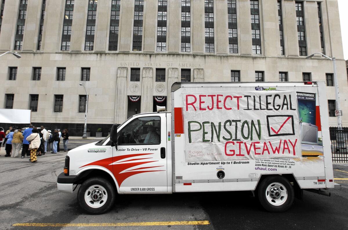 City retirees protest near the federal courthouse in Detroit on July 3. The city's bankruptcy plan would cut the pensions of nonuniform retirees by 4.5%.