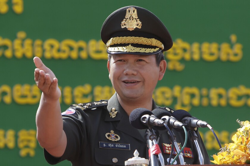 Son of Cambodian Prime Minister Hun Sen, Lt. Gen. Hun Manet delivers a speech while presiding over a military equipment delivery ceremony at the National Olympic Stadium in Phnom Penh, Cambodia, Thursday, June 18, 2020. Cambodia’s long-serving Prime Minister Hun Sen on Thursday, Dec. 2, 2021, explicitly declared his support to have his eldest son, army commander Hun Manet, eventually succeed him as the nation's leader. (AP Photo/Heng Sinith)