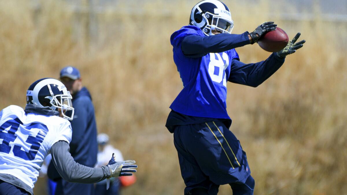 Rams tight end Gerald Everett (81) catches a pass against safety John Johnson (43) during rookie minicamp last month.