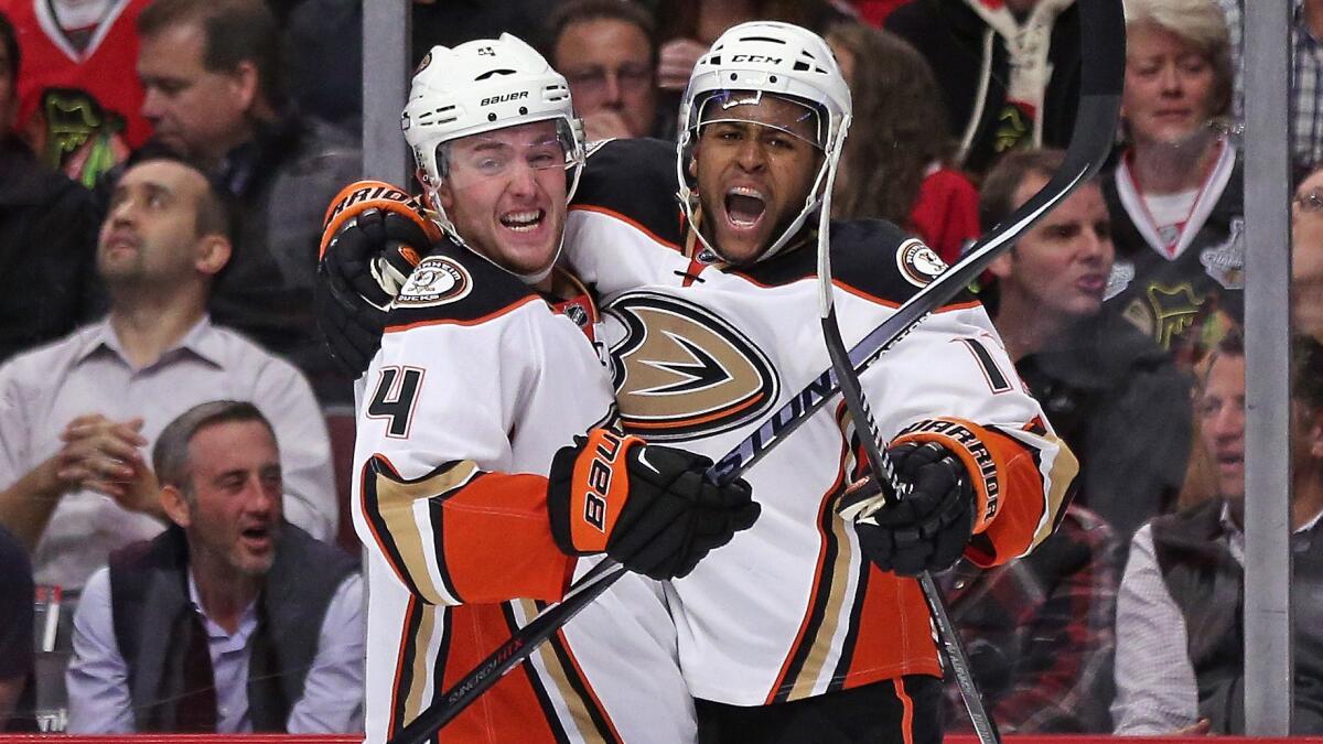 Ducks forward Devante Smith-Pelly, right, celebrates with teammate Cam Fowler after scoring a short-handed goal in a 1-0 victory over the Chicago Blackhawks on Tuesday.