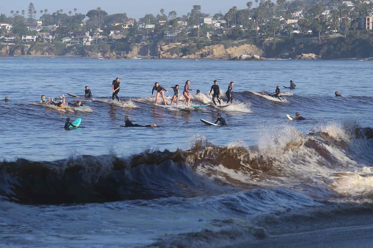Surfers ride at Thalia Street Beach in Laguna Beach on Tuesday.