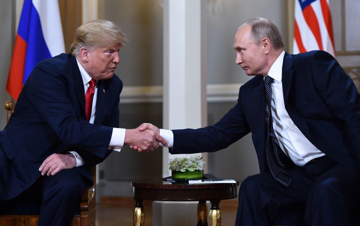 President Trump and Russian President Vladimir Putin shake hands in Helsinki, Finland, in 2018.