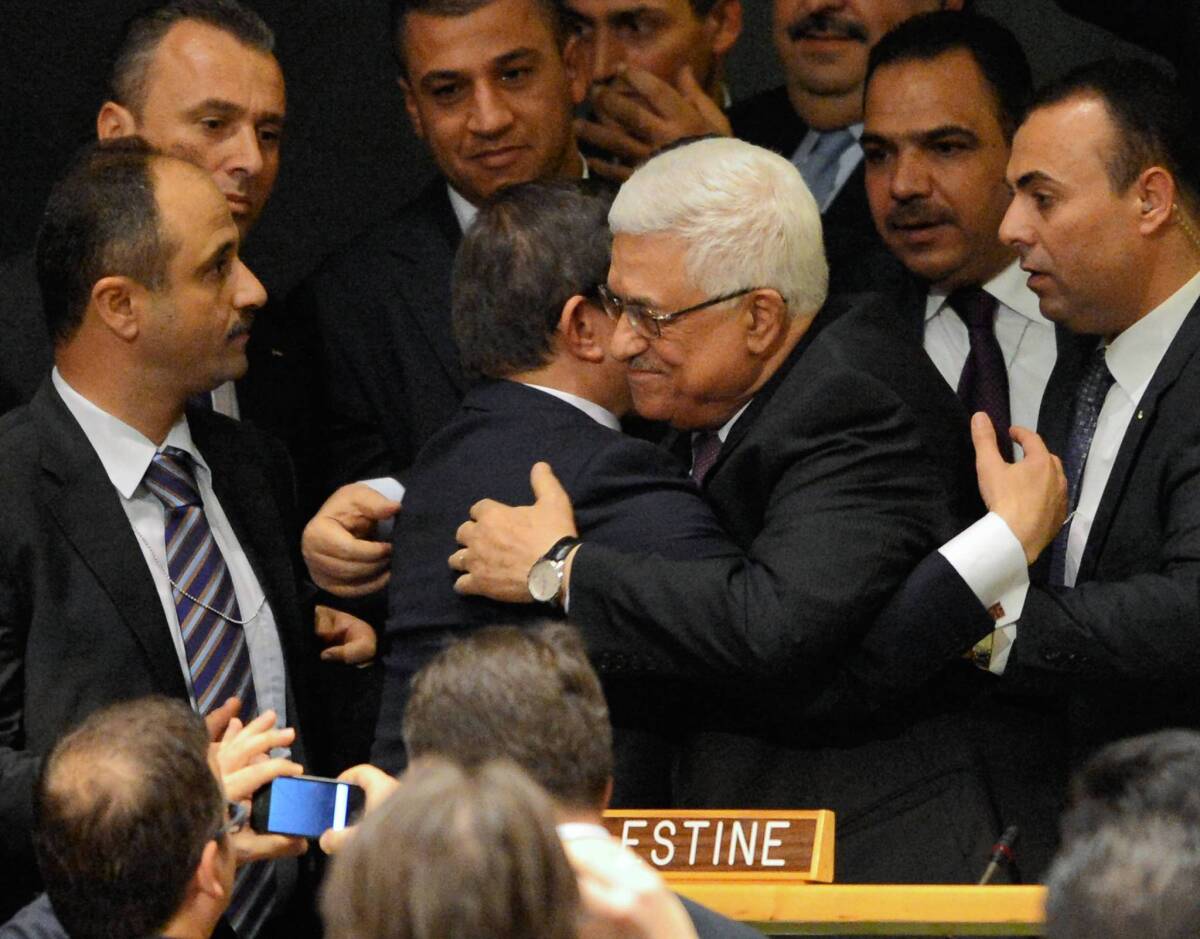 Palestinian Authority President Mahmoud Abbas celebrates after the U.N. vote on Thursday.