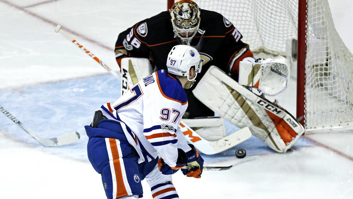 Oilers center Connor McDavid flips a shot toward Ducks goalie John Gibson during the second period of Game 5.