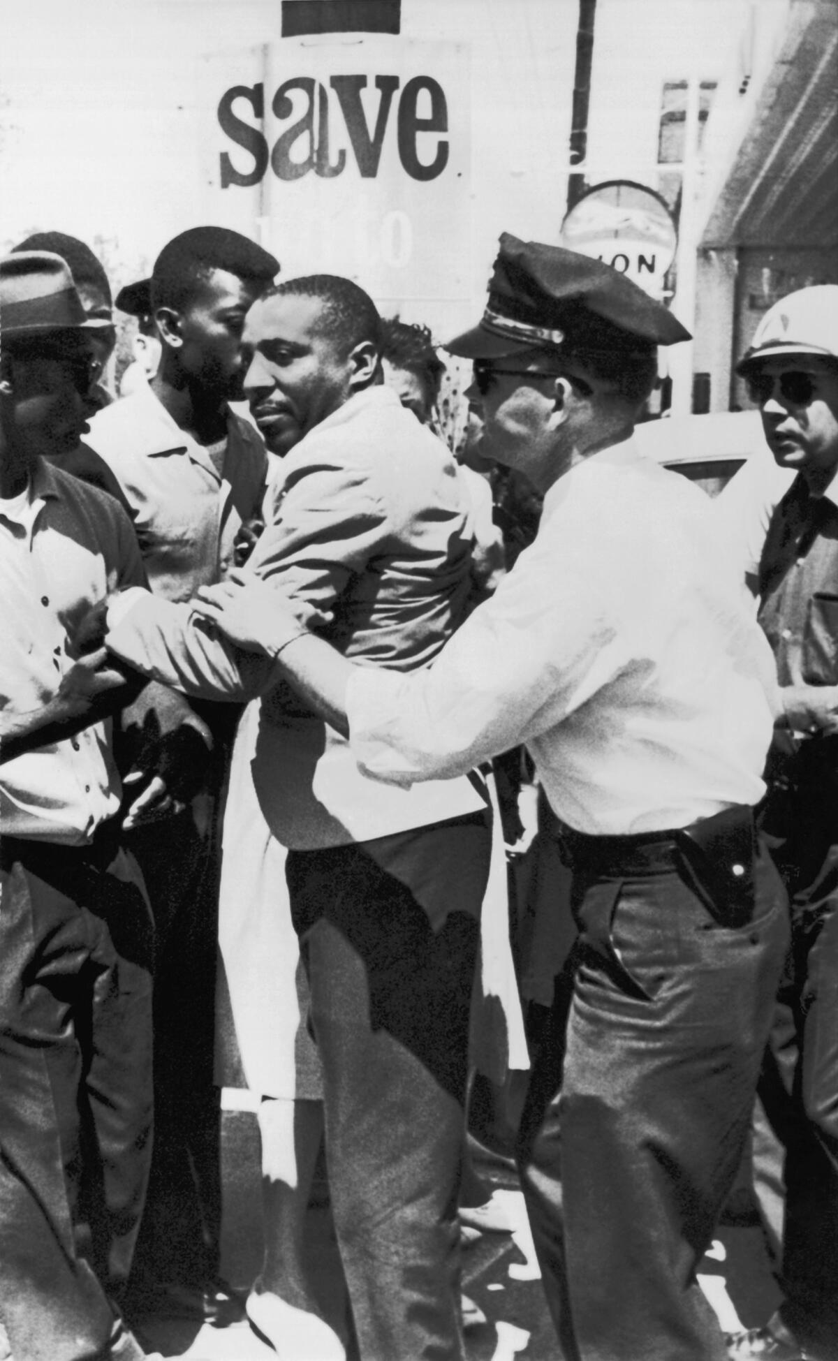 Dick Gregory is accosted by police in Mississippi on April 2, 1963