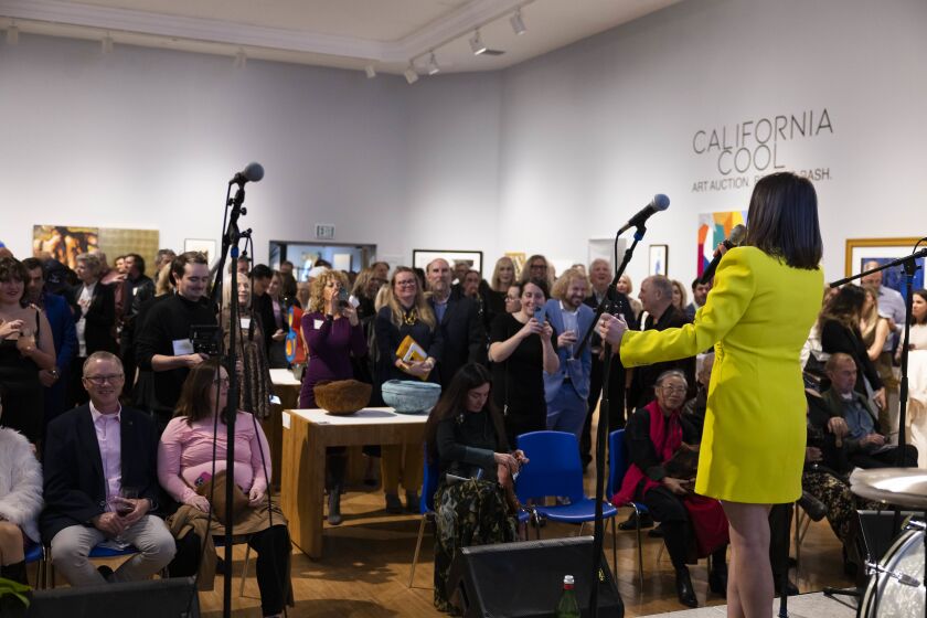 Laguna Art Museum executive director Julie Perlin Lee speaks to the crowd at the California Cool Art Auction.