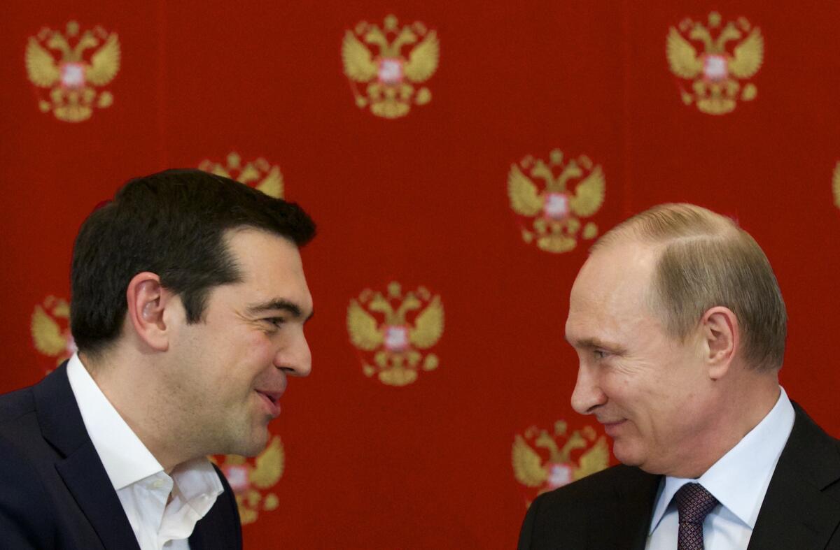 Greek Prime Minister Alexis Tsipras, left, and Russian President Vladimir Putin on Wednesday discussed ways of reviving trade in spite of European Union sanctions and Russia's retaliatory embargo on European food imports.