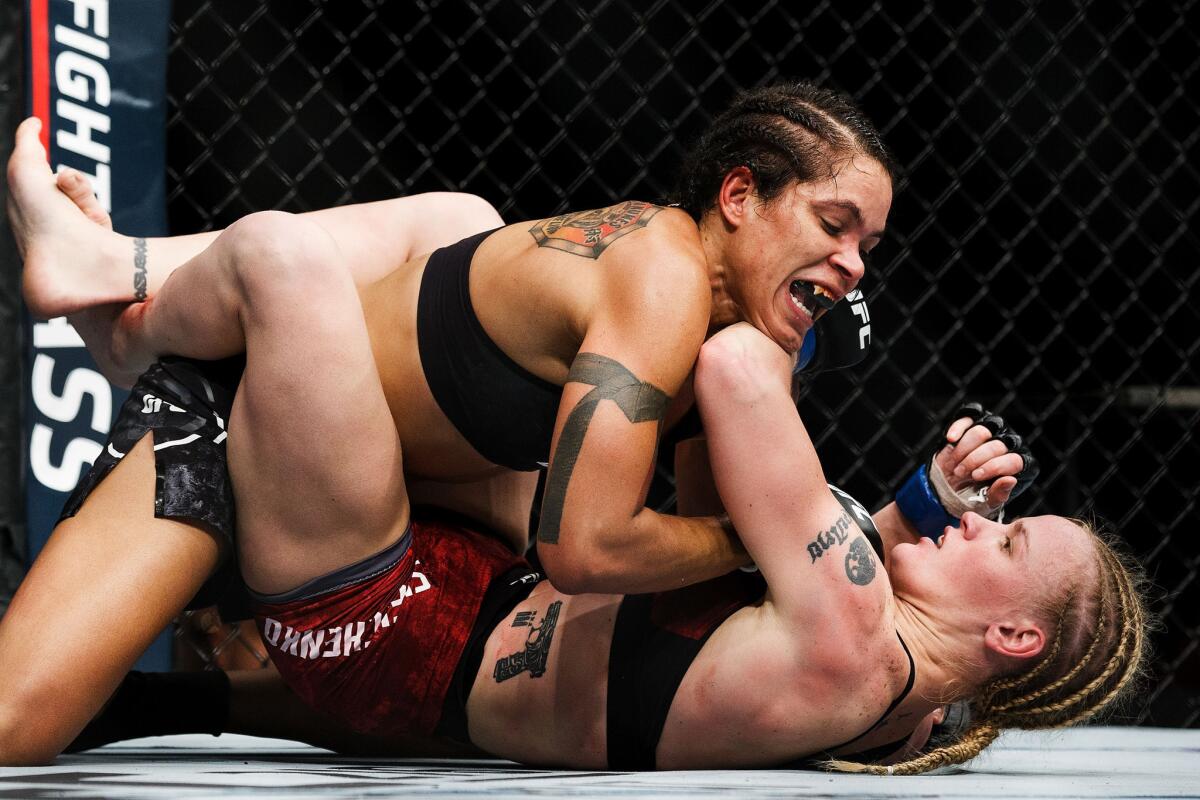 Amanda Nunes, top, and Valentina Shevchenko grapple during their title fight at UFC 215.