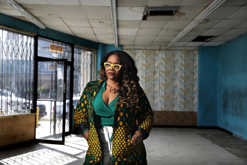 LOS ANGELES-CA-MARCH 10, 2021: Whitney Beatty is photographed in her empty storefront in Los Angeles on Wednesday, March 10, 2021. Beatty, who dreams of running a cannabis shop that caters to women of color, is seeking to open the dispensary through L.A.'s social equity program, which aims to help entrepreneurs from the communities hit hardest by the war on drugs. The long wait for a license has been a financial burden for Beatty, a single mother, who has been renting the space since 2019. (Christina House / Los Angeles Times)