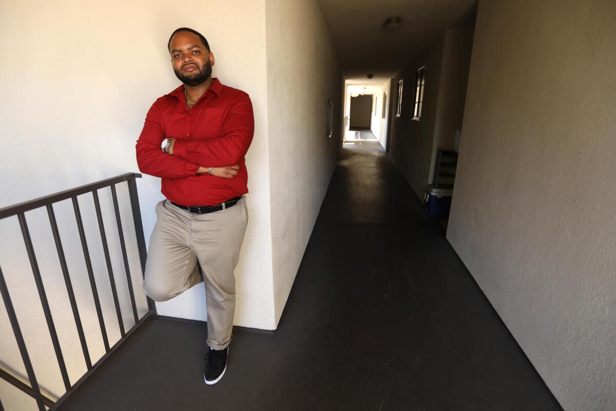 Robert Gardner, a Section 8 tenant, stands in the apartment building where he currently lives in Los Angeles. 