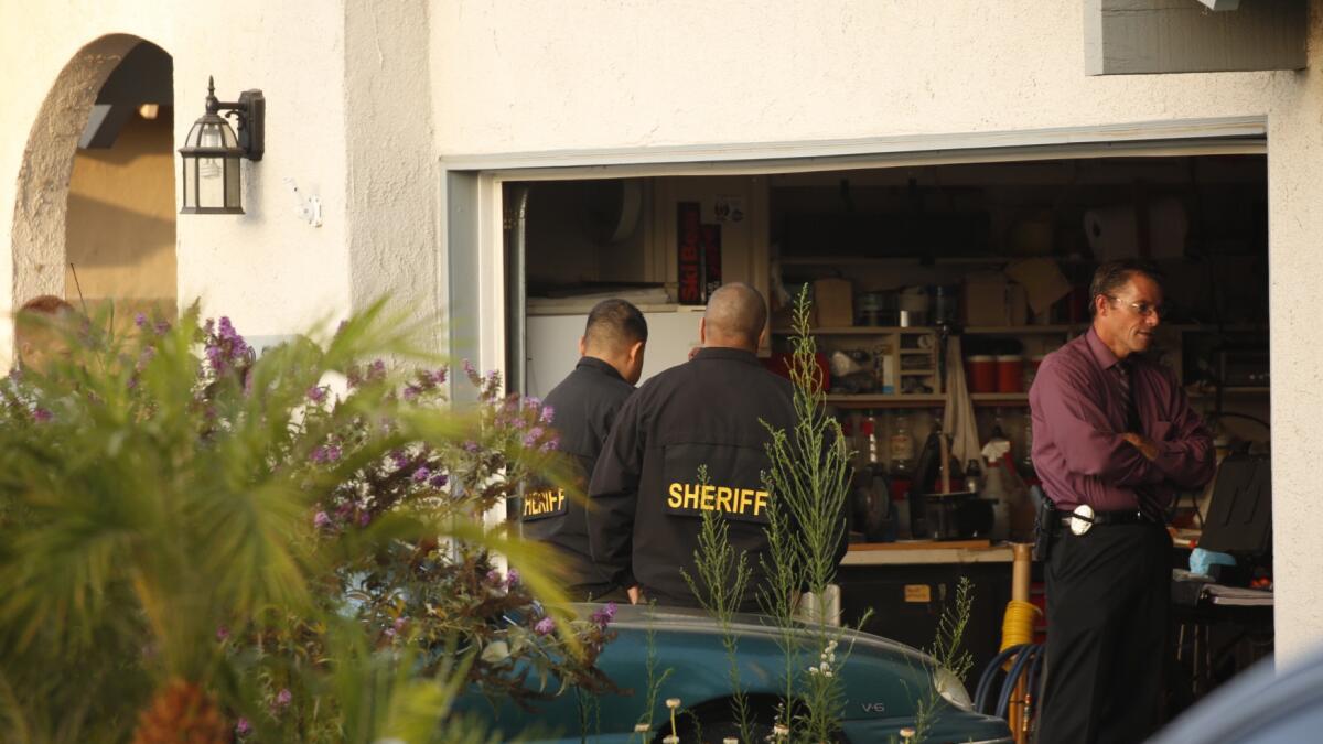 Law enforcement officials investigate a fatal stabbing at a Simi Valley home.