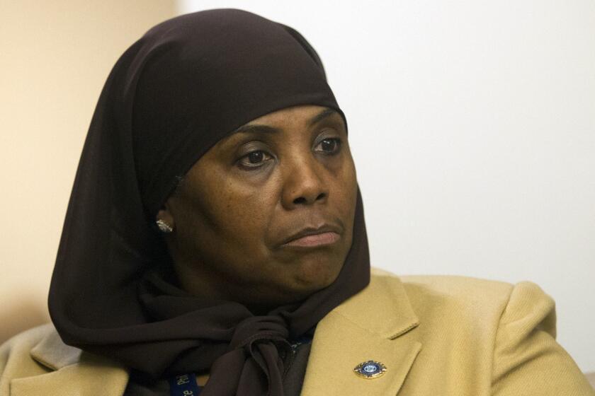 In this Jan. 9, 2018 photo, Movita Johnson-Harrell, Interim Supervisor of Victim Services, looks on after getting introduced, during a press conference at the District Attorney's Office in Philadelphia. Johnson-Harrell, the first female Muslim member of the Pennsylvania House of Representatives, said Tuesday, March 26, 2019, she was offended by a colleague's decision to open a voting session with a prayer a day earlier that "at the name of Jesus every knee will bow." (Jose F/Moreno/The Philadelphia Inquirer via AP)