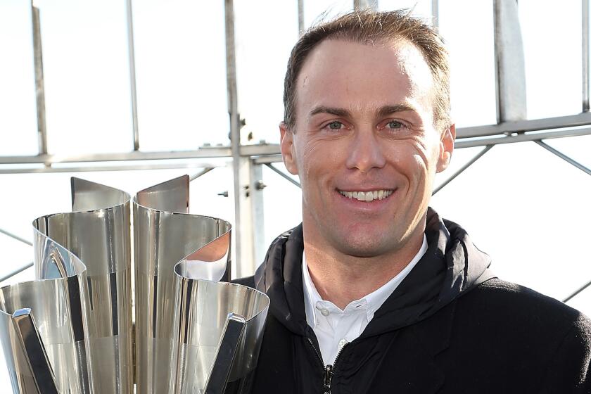 NASCAR Sprint Cup champion Kevin Harvick poses with his championship trophy on top of the Empire State Building on Nov. 18.