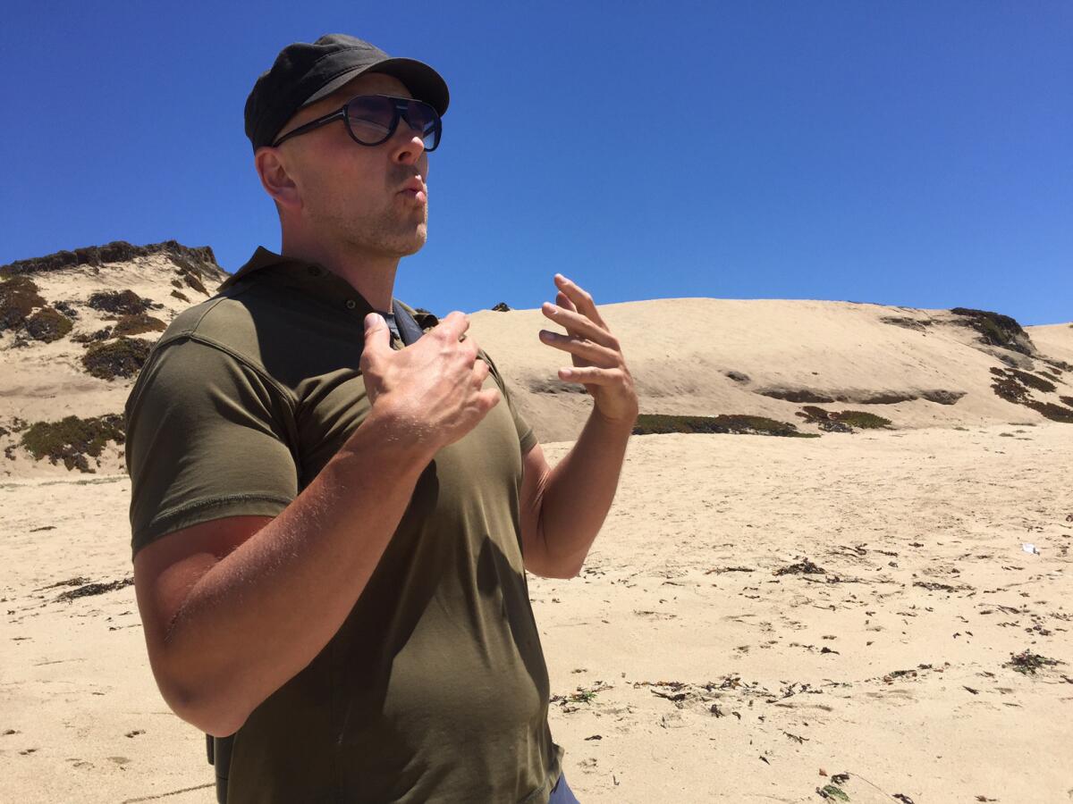 Blake Matheson, president of the Monterey Audubon Society, at the site of a proposed development in Sand City, Calif.