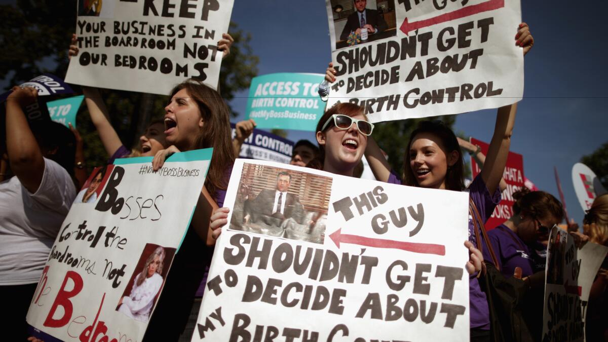 Birth control advocates rally at the Supreme Court in 2014, before the court handed down its decision in the Hobby Lobby religious-freedom case.