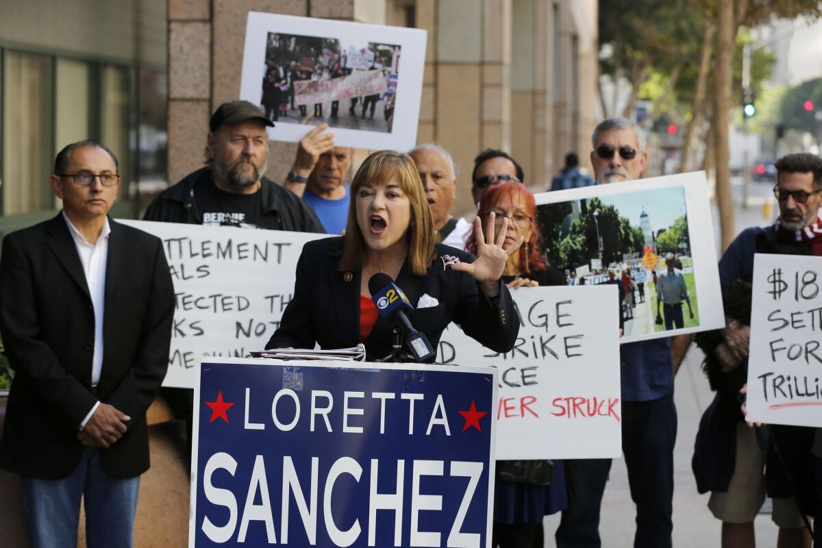 Senate candidate Rep. Loretta Sanchez speaks at a news conference to "expose the failure of the mortgage settlement made by Atty. Gen. Kamala Harris" on Oct. 26 in Los Angeles.