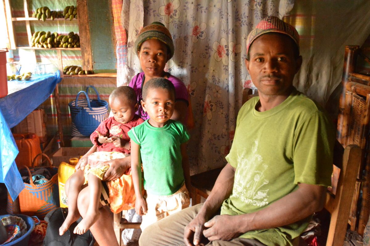 Filgence Rakotoarimanana, his wife, Soahamarina, and two of their six children. The impoverished farmers are not convinced of the benefits of protecting the nearby forest and its lemurs