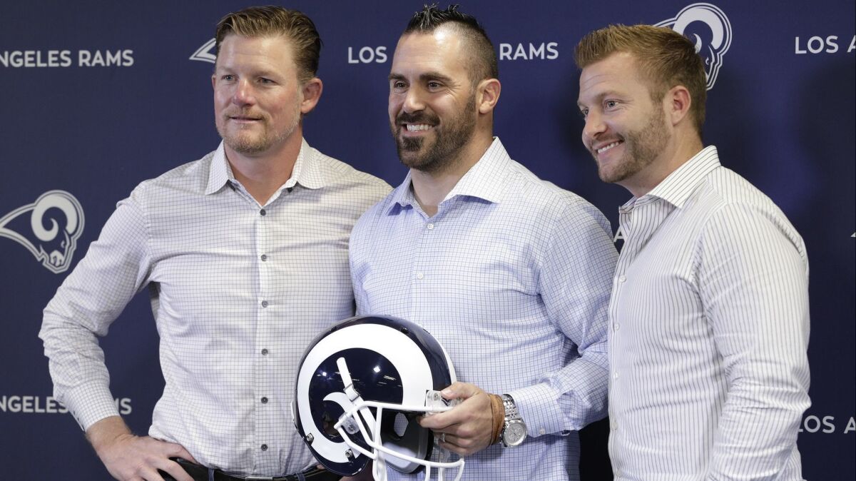 Rams general manager Les Snead, left, with new safety Eric Weddle and coach Sean McVay during a news conference Tuesday.