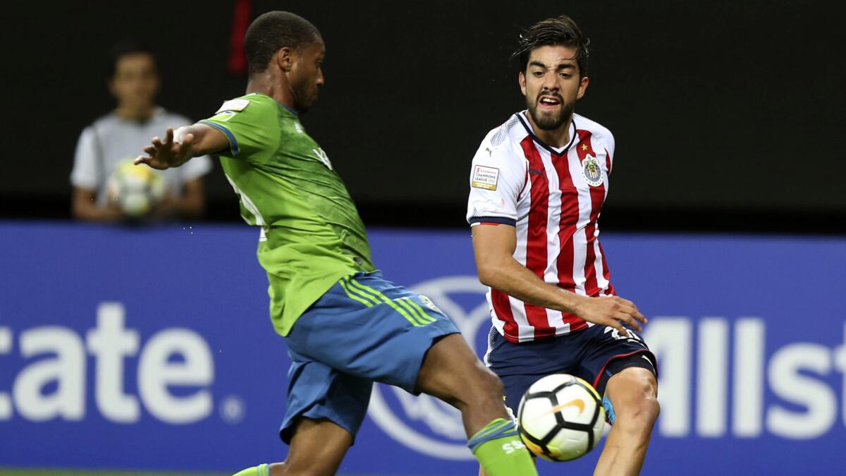Jordan McCrary, left, and the Seattle Sounders gave Rodolfo Pizarro and Chivas of Guadalajara all they could handle in a CONCACAF Champions League quarterfinal.