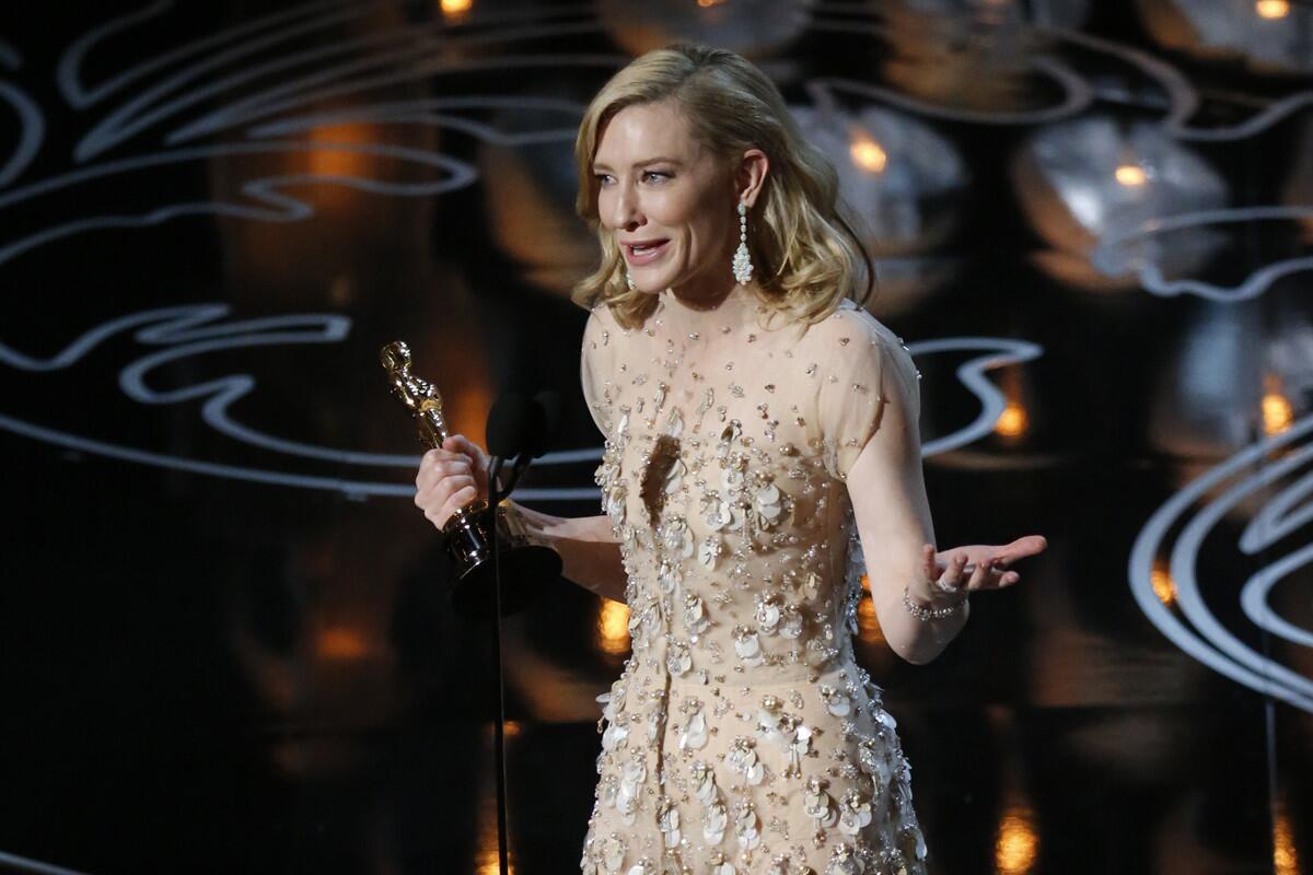 Actress Cate Blanchett accepts her Oscar for lead actress in Woody Allen's "Blue Jasmine."