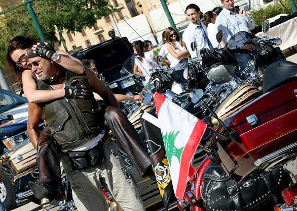 Bikers gather at a parking lot in downtown Beirut as they prepare for the first Lebanon Harley-Davidson tour on Oct. 3, 2008. Clerics and politicians in the Arab world may denounce U.S. foreign policy and the encroachment of Western culture, but these gleaming emblems of American freedom are growing in popularity.