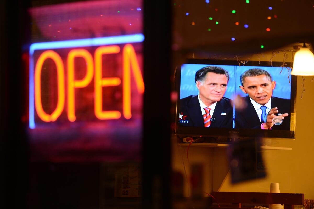 The debate between presidential debate between President Obama and Republican presidential candidate Mitt Romney is seen on a television in a Korean restaurant in Los Angeles.