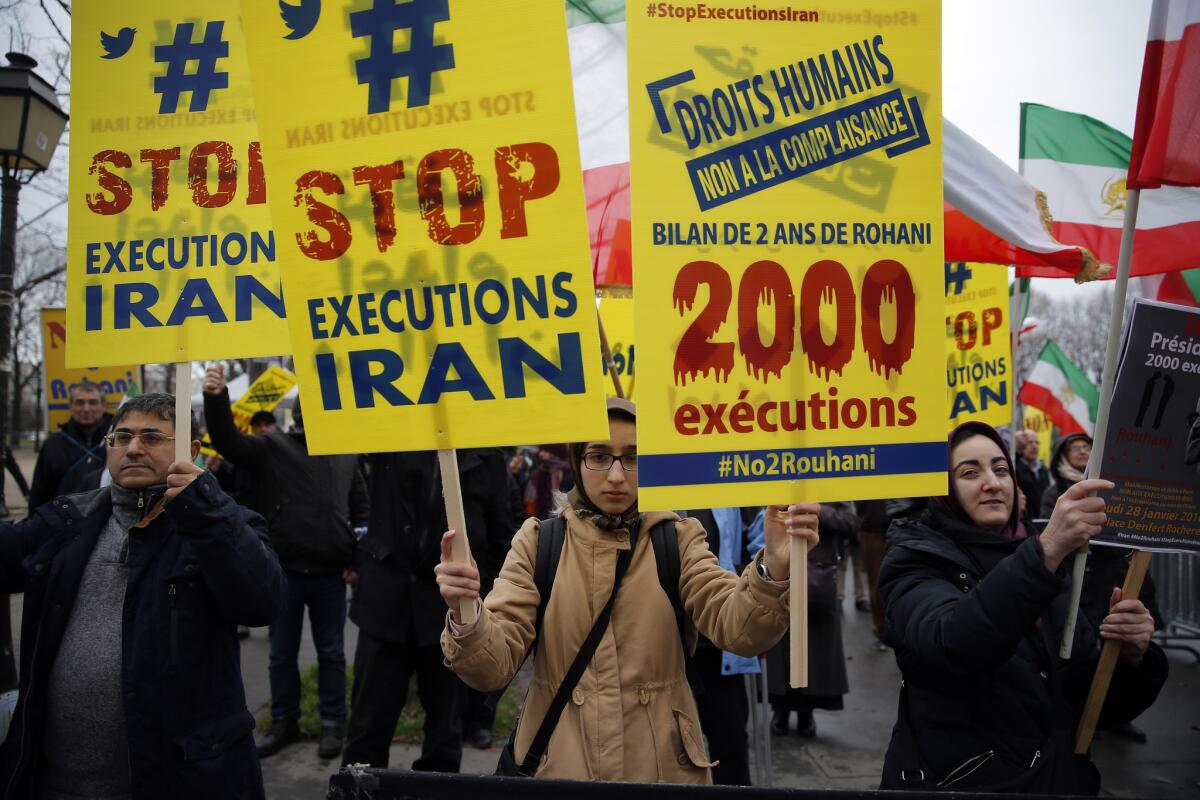 Demonstrators protest Iranian President Hassan Rouhani's visit to Paris in January 2016. Iran executed at least 966 prisoners in 2015, the highest number in over two decades, according to Ahmed Shaheen, the United Nations special rapporteur on human rights in Iran.