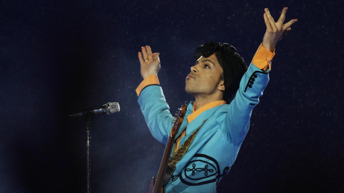 Prince performs during the halftime show at Super Bowl XLI at Dolphin Stadium in Miami in 2007.