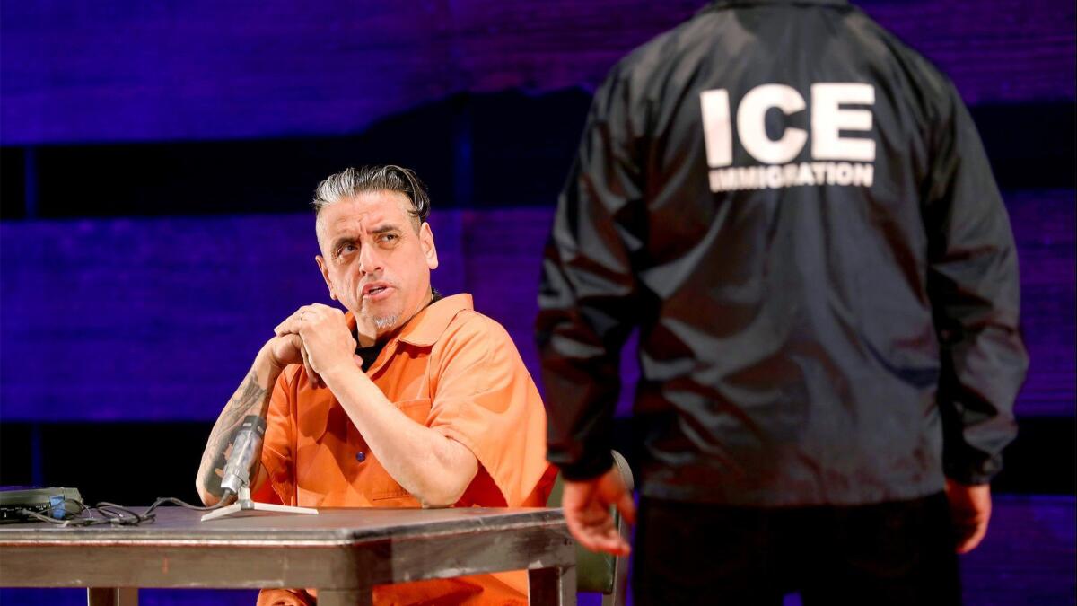Richard Montoya and Ricardo Salinas perform a sketch about a Mexican immigrant being interrogated by ICE agents in the 2019 production of “Culture Clash (Still) in America” at South Coast Repertory.