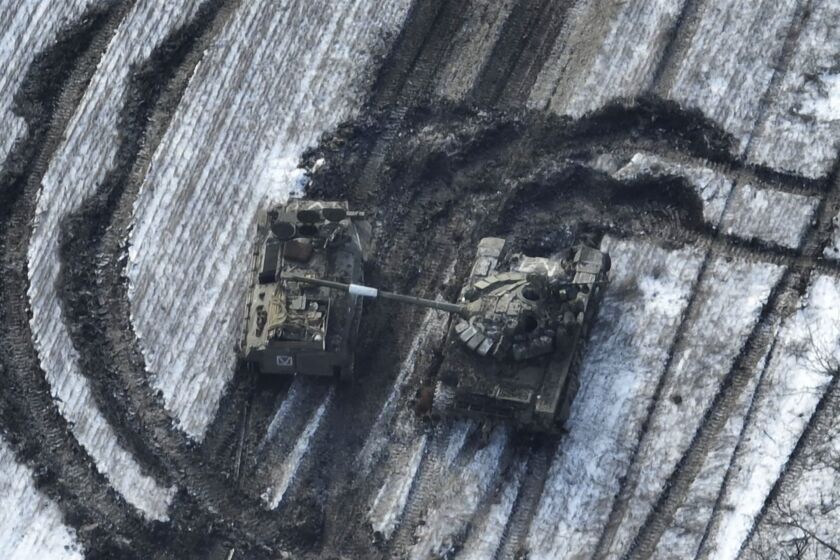 In this image from Ukrainian Armed Forces and taken in Feb. 2023 shows damaged Russian tanks in a field after attempting to attack, Vuhledar, Ukraine. The battle for the small coal-mining town of Vuhledar on Ukraine's eastern front line which has emerged as a critical hot spot in the fight for Donetsk province. Securing the town would give both Ukrainian forces and Russian troops a tactical upper hand in the greater battle for the Donbas region. (Ukrainian Armed Forces via AP)