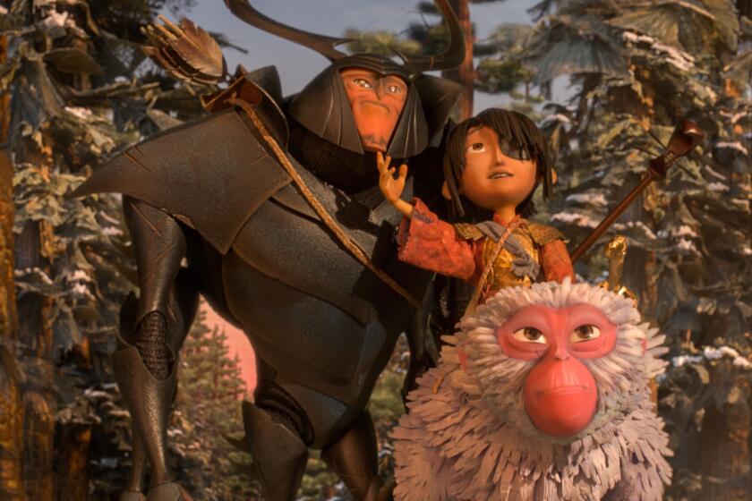 Beetle, voiced by Matthew McConnaghey, Kubo, voiced by Art Parkinson, and Monkey, voiced by Charlize Theron, in "Kubo and the Two Strings."
