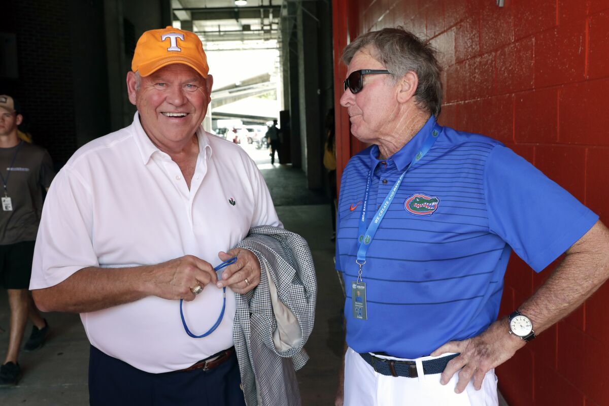 Ex-Tennessee coach and current AD Phillip Fulmer, left, talks with former Florida coach Steve Spurrier on Sept. 21, 2019.