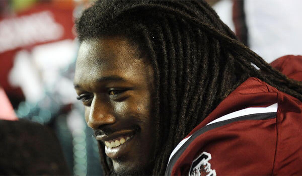 South Carolina defensive end Jadeveon Clowney appears to be in good spirits as he sits out the Gamecocks' matchup against Kentucky on Saturday.
