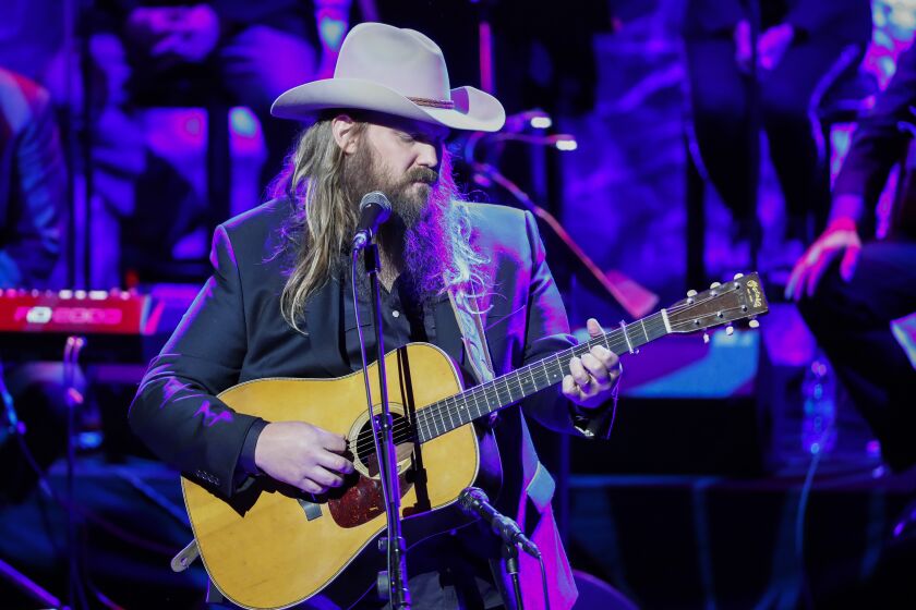 FILE - Chris Stapleton performs at the 2018 Medallion Ceremony at the Country Music Hall of Fame and Museum on Sunday, Oct. 21, 2018, in Nashville, Tenn. Stapleton is one of the top nominees and will also perform at the CMA Awards, Wednesday, Nov. 10, 2021. (Photo by Al Wagner/Invision/AP, File)