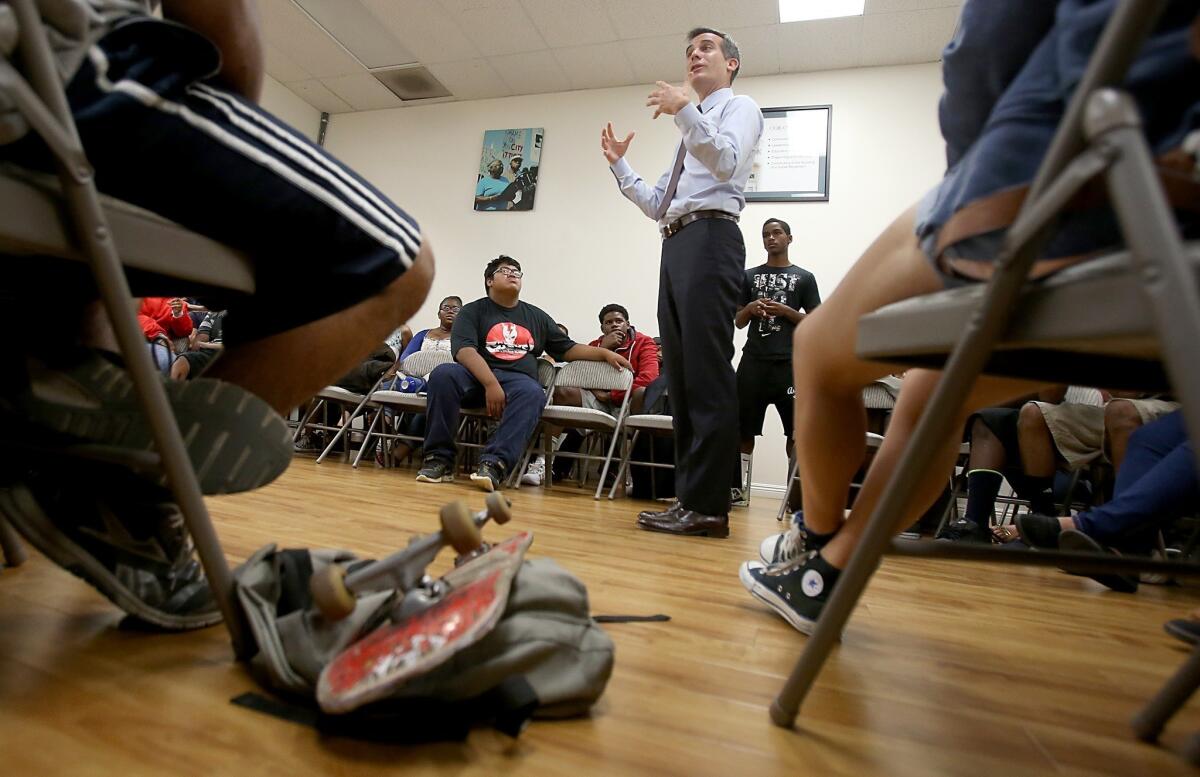 Los Angeles Mayor Eric Garcetti talks with young residents of South Los Angeles at the Community Coalition Center on Tuesday. The mayor told the group to seek redress and justice for Trayvon Martin through peaceful and nonviolent means.