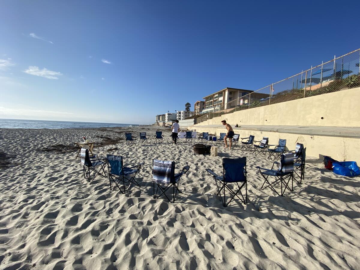 A bonfire party organized by events company A Timeless Day is set up at La Jolla's Marine Street Beach in 2021.