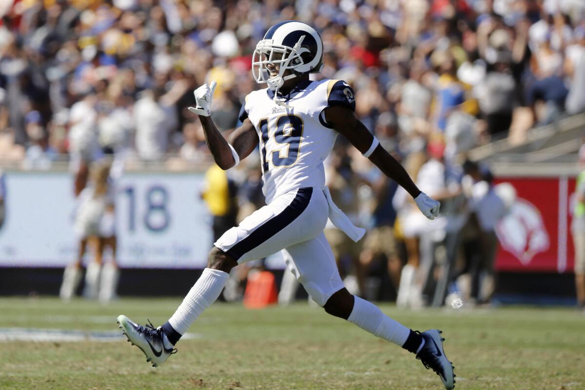 Rams kick returner JoJo Natson celebrates a return against the Arizona Cardinals in the first half at the Los Angeles Memorial Coliseum on Sunday.