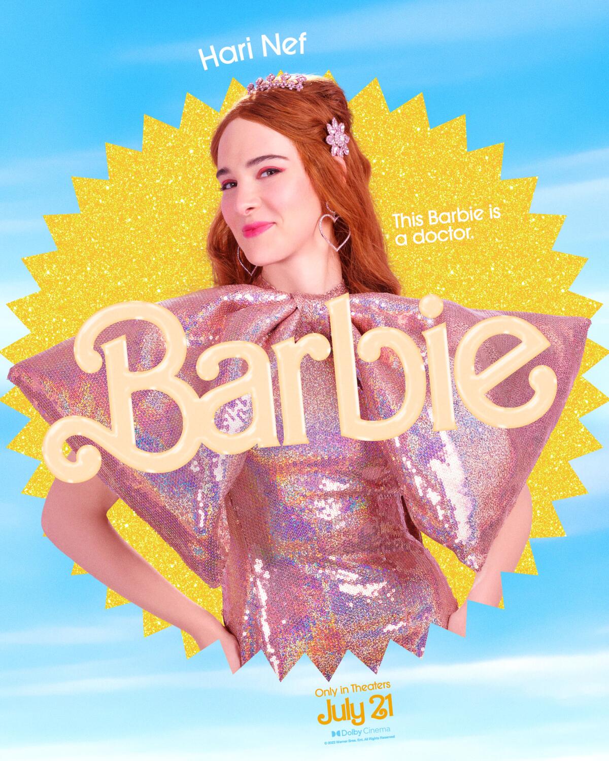 Hari Nef poses with her hands on her hips in a "Barbie" movie poster. She wears a shiny pink dress with poofy sleeves.