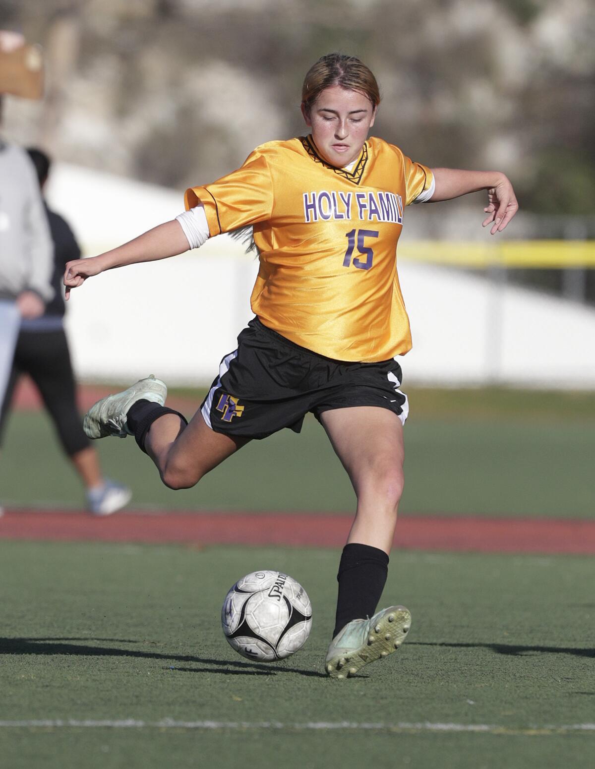 Holy Family's Brianna Cindrich gets off a shot and scores during Holy Family's 5-1 Horizon League home loss against Alverno Heights on Monday at the Glendale Sports Complex.