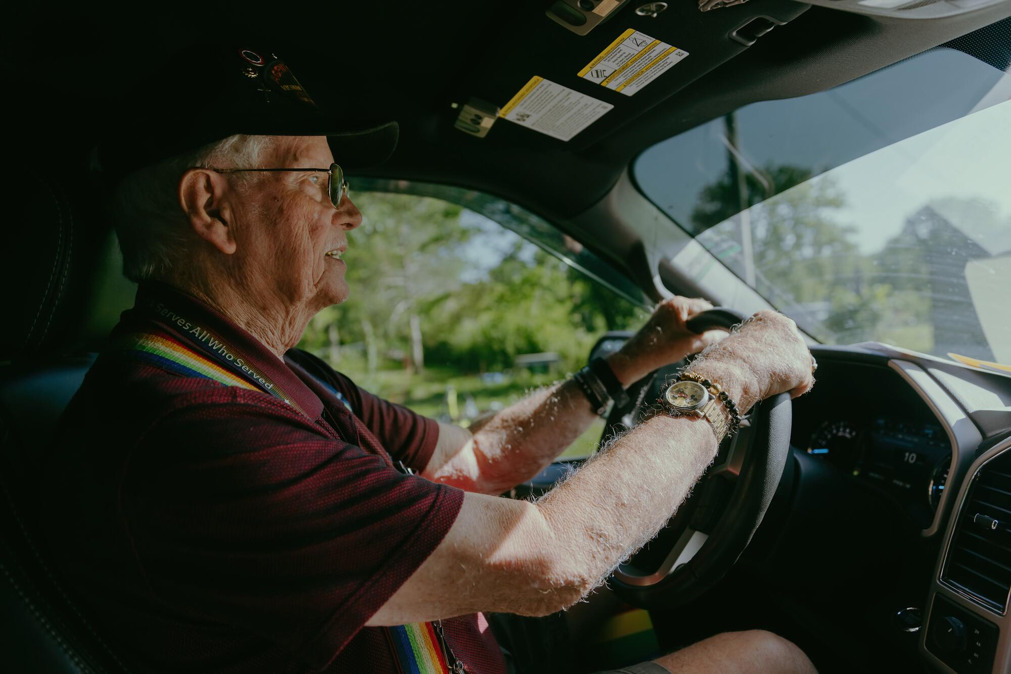 Gene Ulrich drives his truck in Bunceton, Mo.