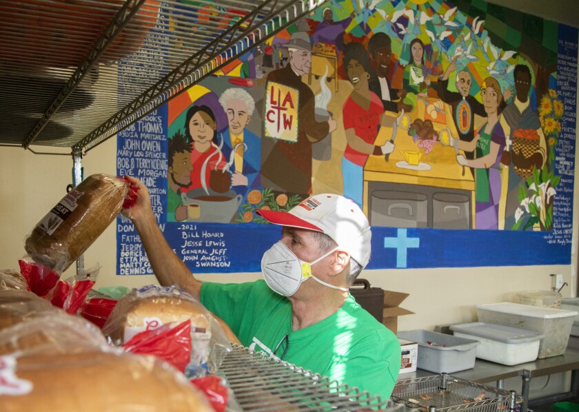  Volunteer Jack Hastert works in the kitchen.