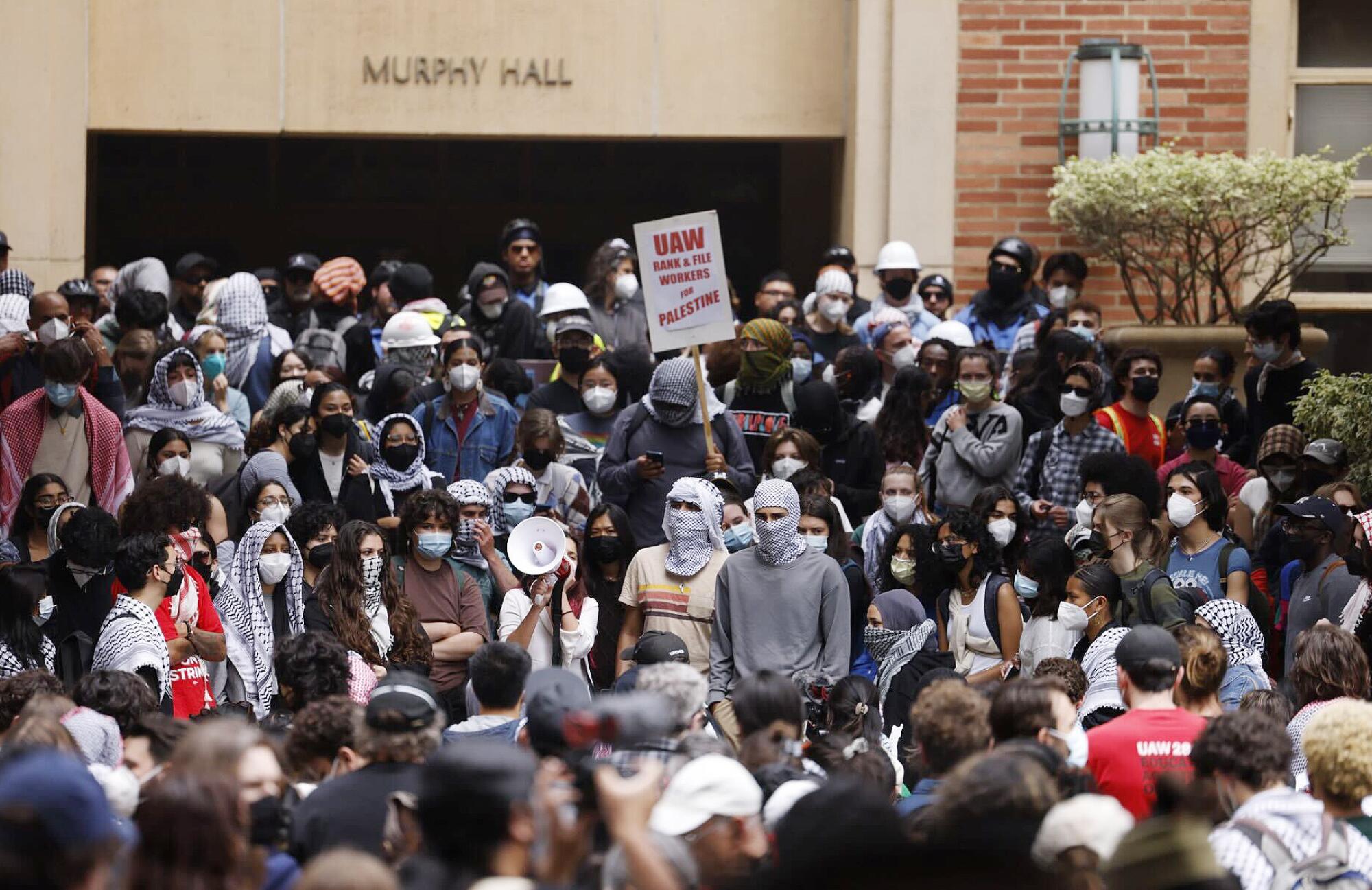 Demonstrators gather outside Murphy Hall on the Westwood campus on Thursday.