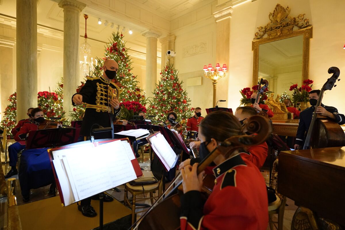 A U.S. Marine Corps band performs in the Entrance Hall of the White House during the 2020 Christmas preview, Monday, Nov. 30, 2020, in Washington. (AP Photo/Patrick Semansky)