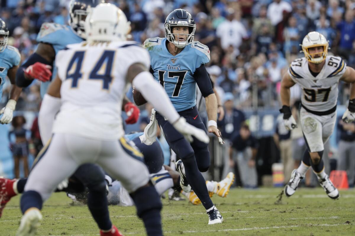 Titans quarterback Ryan Tannehill scrambles for yardage in the fourth quarter against the Chargers.