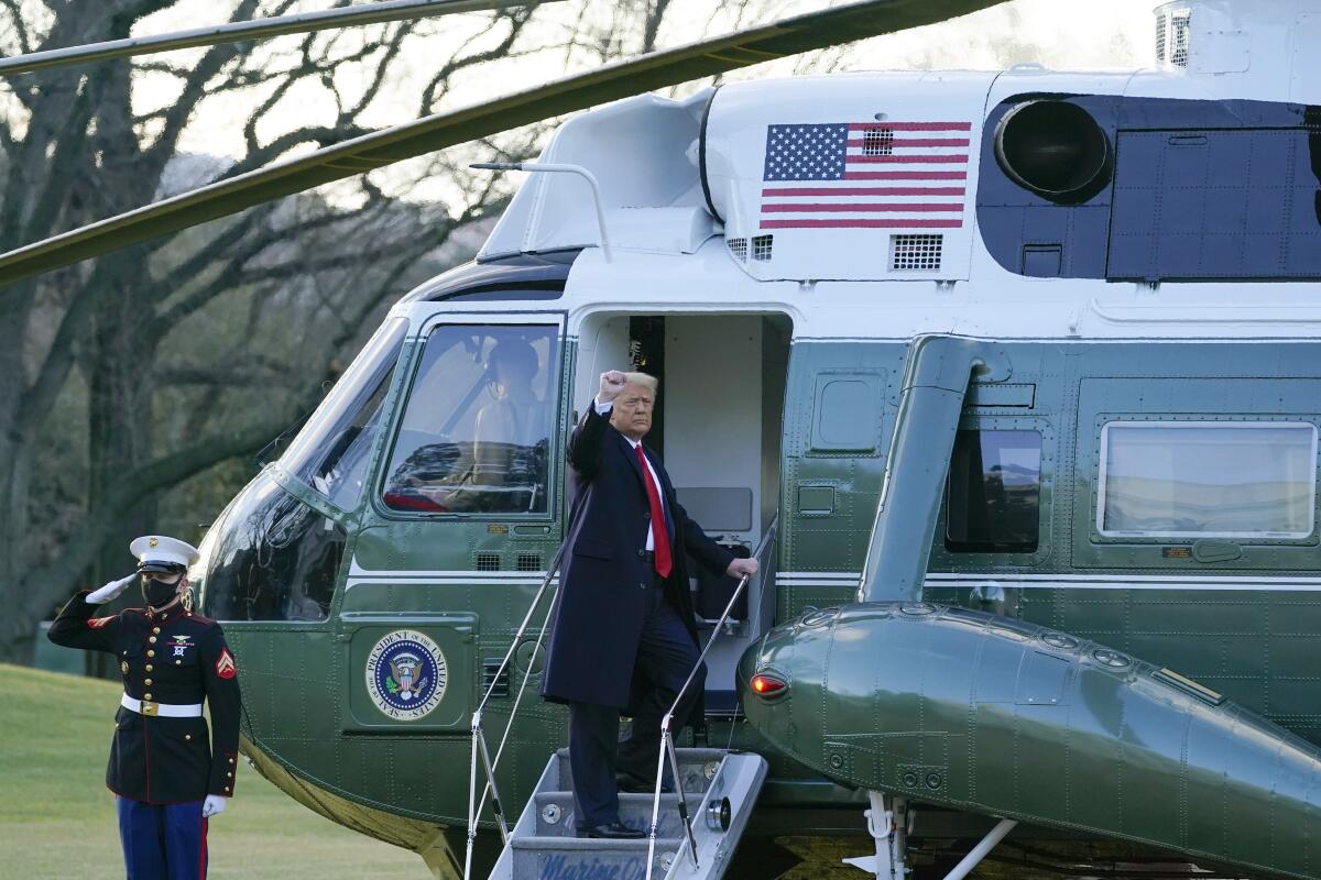 President Donald Trump gestures as he boards Marine One on the South Lawn of the White House.