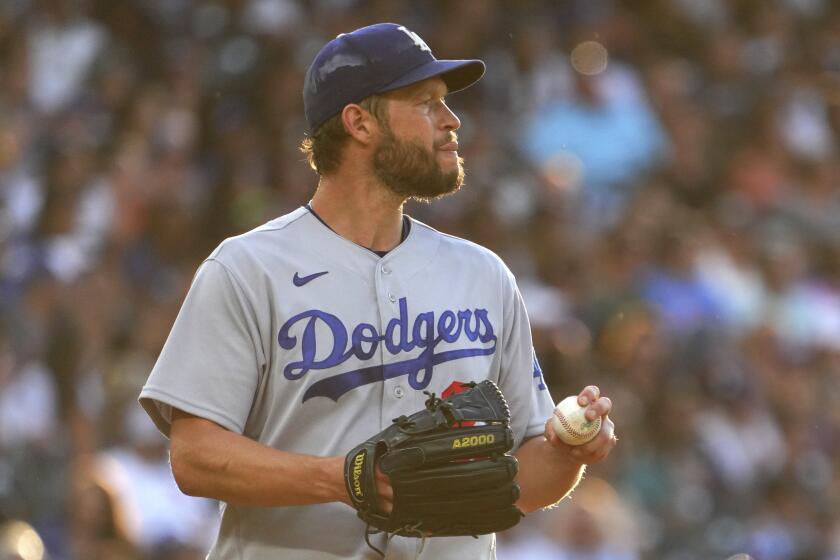 Los Angeles Dodgers starting pitcher Clayton Kershaw (22) looks on against the Colorado Rockies.
