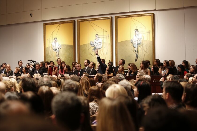 Bidders compete for Francis Bacon's "Three Studies of Lucian Freud," at a Christie's auction in November in New York.