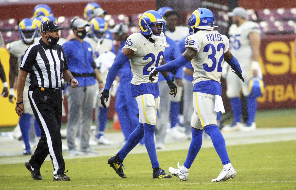 Rams cornerback Jalen Ramsey and strong safety Jordan Fuller celebrate during a game against the Washington Football Team.